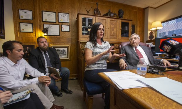 Brenda Mayes, center, speaks during a press conference at the office of her attorney, Robert Sykes,...