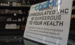 Vape store owners must display this warning, which says "vaping unregulated THC is dangerous."