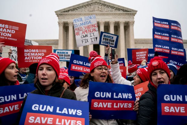 Gun safety advocates rally in front of the U.S. Supreme Court before during oral arguments in the Second Amendment case NY State Rifle & Pistol v. City of New York, NY on December 2, 2019 in Washington, DC. Several gun owners and the NRA's New York affiliate challenged New York City laws concerning handgun ownership and and they contend the citys gun license laws are overly restrictive and potentially unconstitutional. (Photo by Drew Angerer/Getty Images)