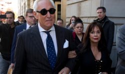 In this Nov. 15, 2019, file photo, Roger Stone, left, with his wife Nydia Stone, leaves federal court in Washington. Federal prosecutors are asking a judge to sentence Stone to serve between 7 and 9 years in prison after his conviction on witness tampering and obstruction charges. (Jose Luis Magana / AP)