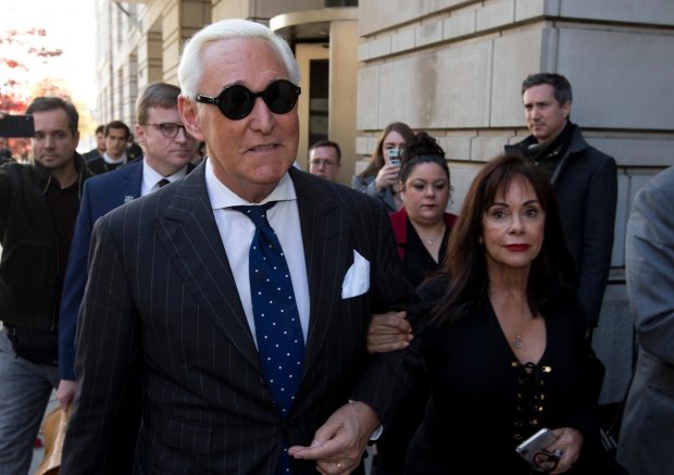 In this Nov. 15, 2019, file photo, Roger Stone, left, with his wife Nydia Stone, leaves federal court in Washington. Federal prosecutors are asking a judge to sentence Stone to serve between 7 and 9 years in prison after his conviction on witness tampering and obstruction charges. (Jose Luis Magana / AP)