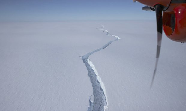 An airplane flies over the North Rift crack in the Brunt Ice Shelf in January.
(British Antarctic S...