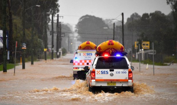 Emergency rescue vehicles drive through flooded parts of western Sydney, Australia, on March 20. (S...