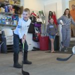 Libby Mortimer watches her three sons play hockey in the garage. She's found she can be a better mother when she prioritizes her own self-care through journaling, exercise, praying, and therapy. Photo Credit: KSL TV