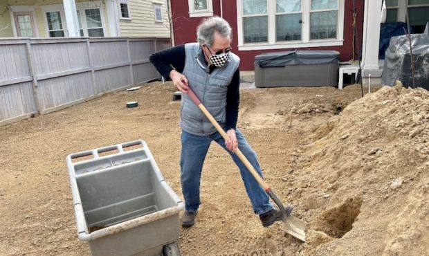 Bruce Hutchinson is sowing seeds of normalcy while planting his new yard after getting his COVID-19...