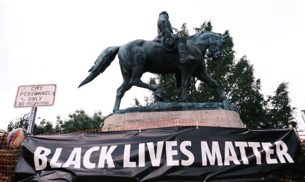 FILE: The statue of Robert E Lee with a banner that reads "Black Lives Matter" during the "Reclaim ...