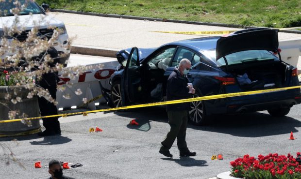Law enforcement investigate the scene after a vehicle charged a barricade at the U.S. Capitol on Ap...