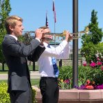 Erik Whicker and his friend, Tyler Robinson, play "Taps" at the Herriman Cemetery on Memorial Day. (Jed Boal/KSL TV)