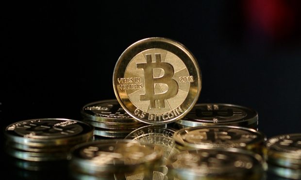 Bitcoin and other cryptocurrencies are all making news with wild up-and-down swings in value. (File...