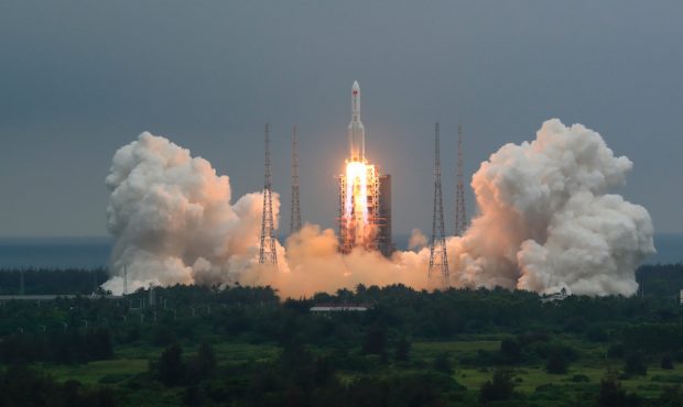 In this photo released by China’s Xinhua News Agency, a Long March 5B rocket carrying a module fo...