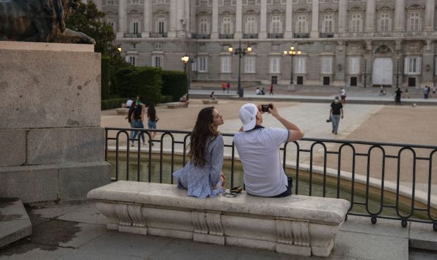 A couple sit as they take a picture at Opera Square on June 07, 2021 in Madrid, Spain. Spain, the w...