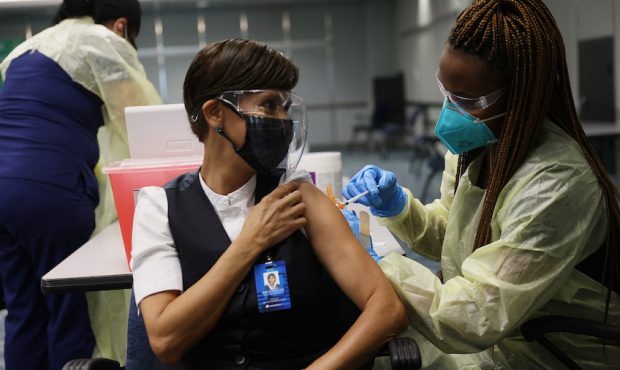 FILE: Angelica Segura Miravete, who works for AeroMexico, gets a Pfizer-BioNtech COVID-19 vaccinati...