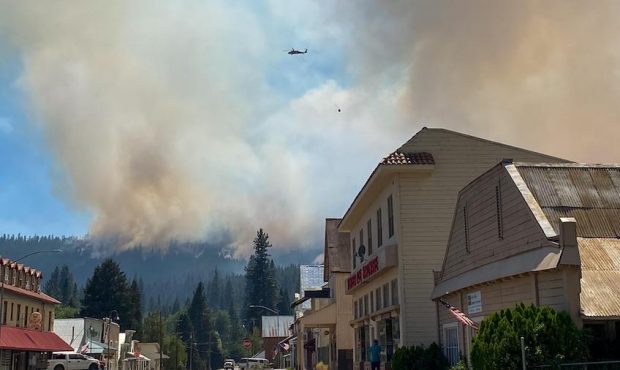 Smoke from the Dixie Fire is seen from Main Street in Greenville, California. (U.S. Forest Service)...