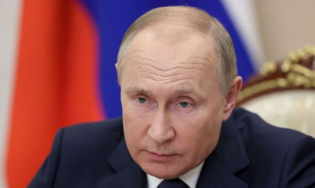 FILE - Russias President Vladimir Putin holds a video conference to address participants in a congr...