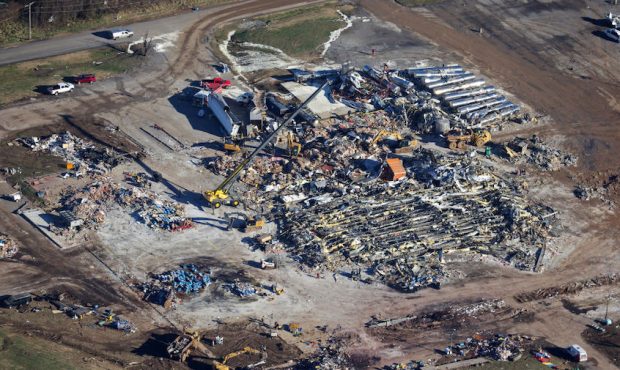 In this aerial view, crews clear the rubble at the Mayfield Consumer Products candle factory after ...
