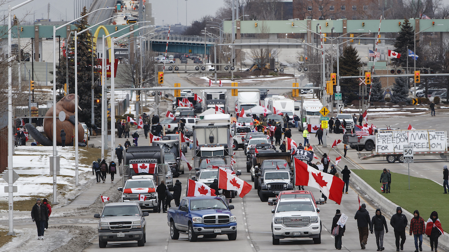 Protesters and supporters set up at a blockade at the foot of the Ambassador Bridge, sealing off th...