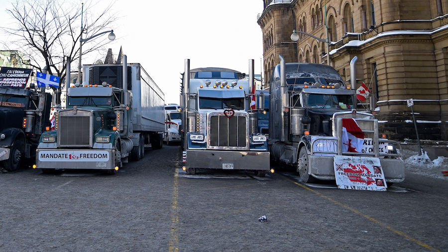 Trucks lined up next to the Parliament building during the 4th Day of Trucker's protest against the...