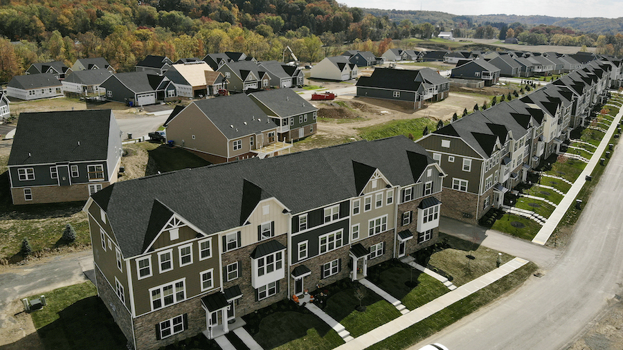 FILE: Mortgage rates just hit a 12-year high. In this image taken with a drone, new townhouses are ...