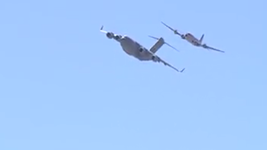 An Air Force C-17 Globemaster named “The Spirit of the Candy Bomber” escorted a C-54 to Spanish...