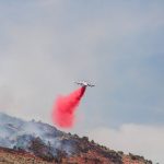 A plane spraying down the fire. (Credit: Chaice Moyes)