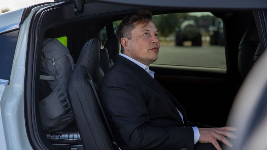 FILE: Tesla head Elon Musk leaves after giving a statement to the press as he arrives to have a loo...