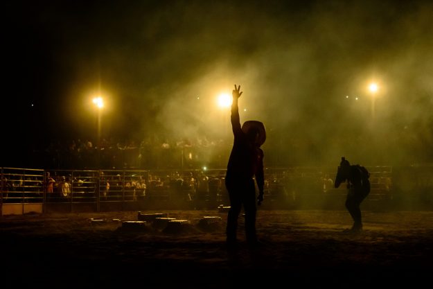 Silhouette of cowboy at days of 47 rodeo