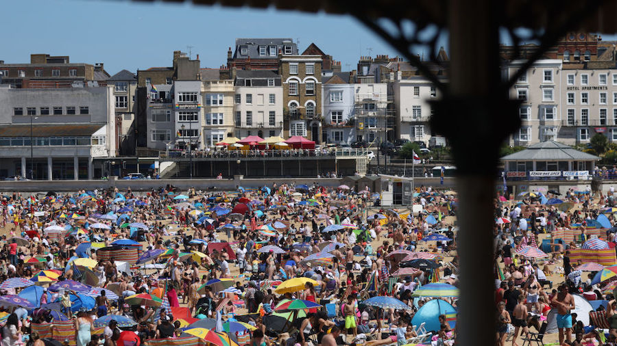 People enjoy the hot weather at Margate beach on July 16, 2022 in Margate, United Kingdom. Britain ...