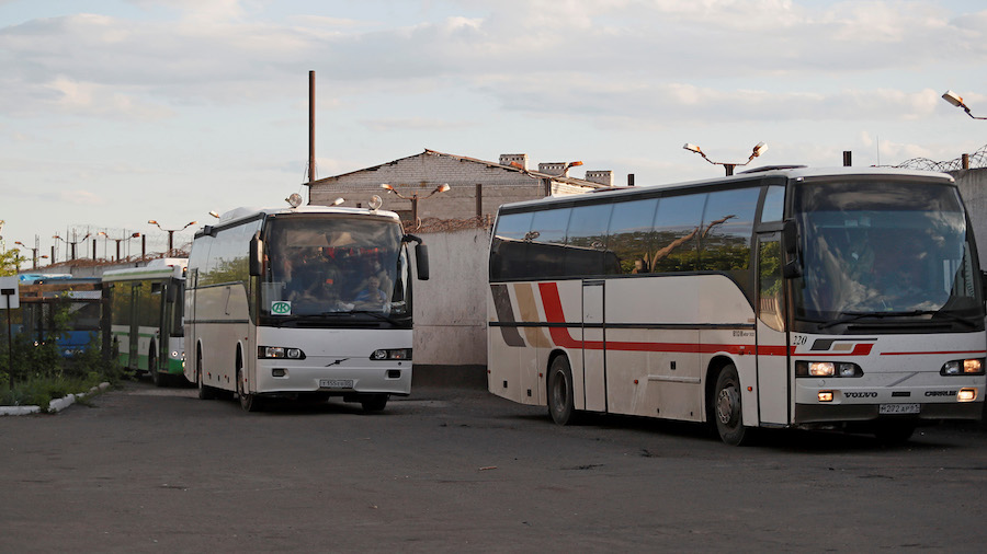 In this file photo from May 17, buses carrying Ukrainian soldiers arrive at a detention facility in...