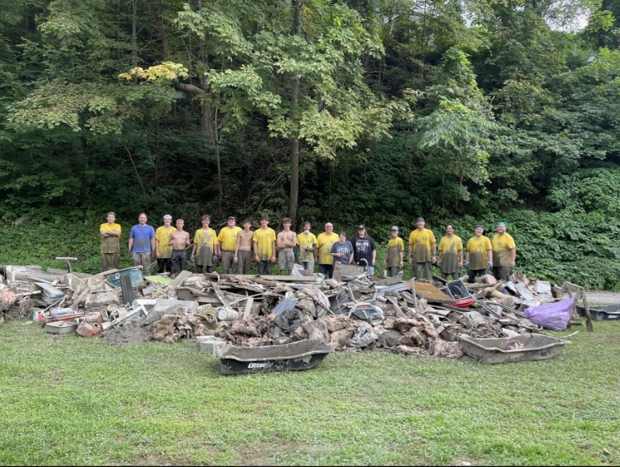 Members of the Crestwood Kentucky Stake show some of the debris removed from flooded homes in Hazar...