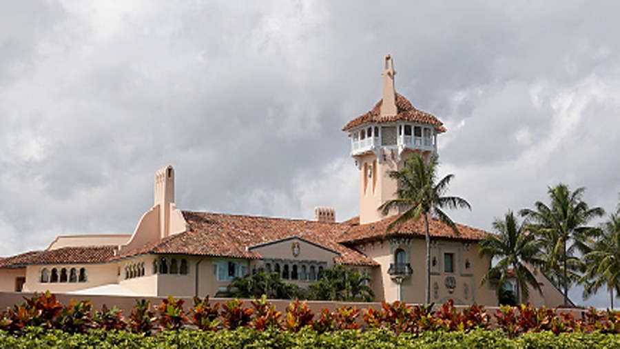 FILE: A car passes in front of former President Donald Trump's Mar-a-Lago resort on February 11, 20...