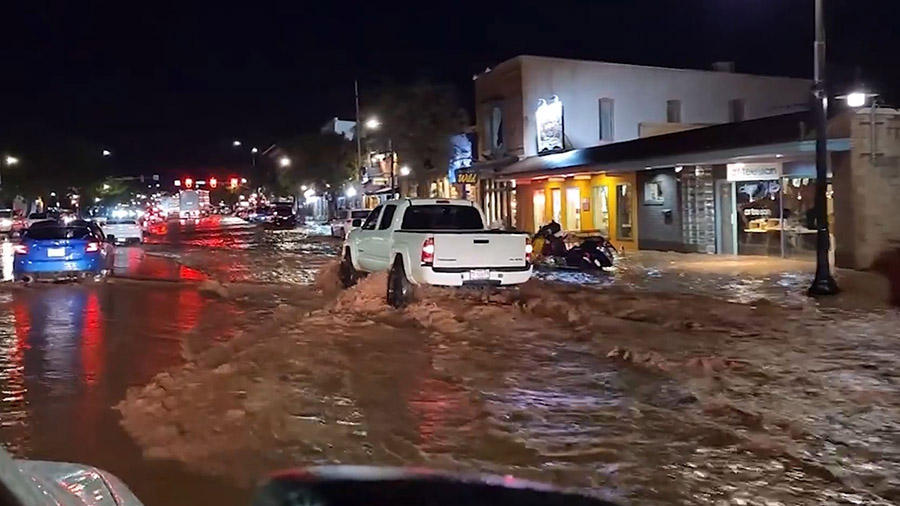 The streets of Moab flooded Saturday night. (Courtesy: Jason Booth)...