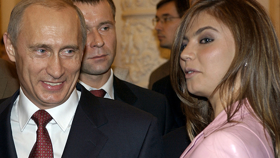 FILE - In this Thursday, Nov. 4, 2004 file photo President Vladimir Putin, left, speaks with gymnas...