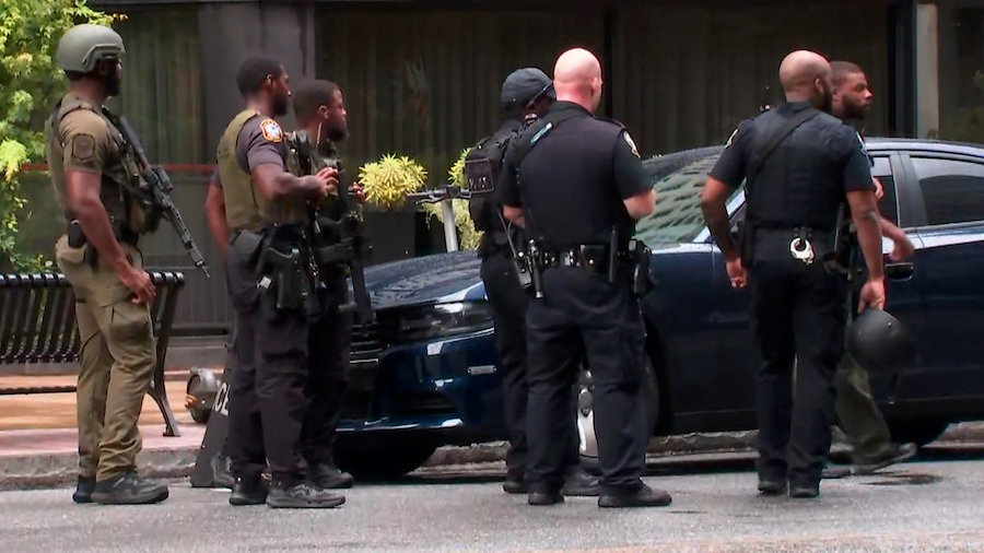 Law enforcement officers respond to the scene of a triple shooting in Atlanta. (WGCL via CNN)...