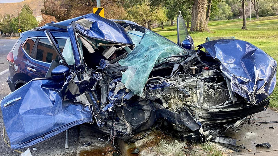 SUV "mangled" in crash. (Salt Lake City Police Department)...