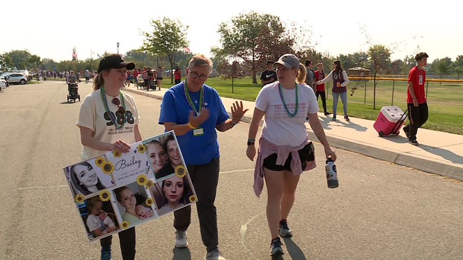 Carla Jones, center, was joined by her daughter and a friend at the Out of the Darkness Walk in Wes...