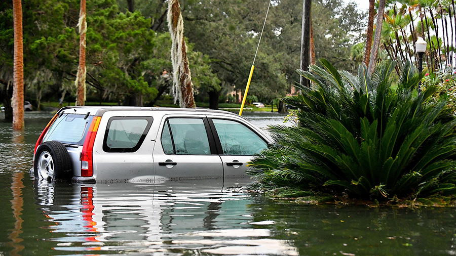 A car sits in floodwater after Hurricane Ian on September 29, 2022 in Orlando, Florida. (Gerardo Mo...