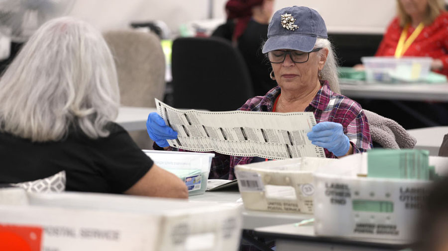 PHOENIX, ARIZONA - NOVEMBER 11: Election workers open mail in ballots at the Maricopa County Tabula...