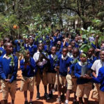 School children carrying fruit tree seedlings in Dodoma Tanzania 16 Nov 2022. (Intellectual Reserve, Inc.)