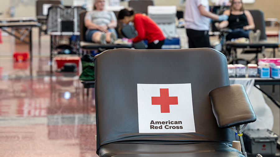 An empty donation table with the American Red Cross logo. (Jon Cherry/Getty Images)...