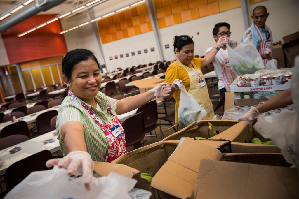 FILE: CAMDEN, NJ - AUGUST 21:  Volunteers help bag to-go meals at Catherdral Kitchen on August 21, ...