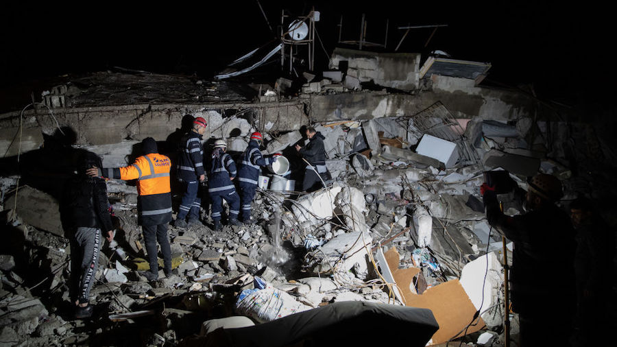 Rescue workers attend the scene of a collapsed building on February 06, 2023 in Iskenderun Turkey. ...