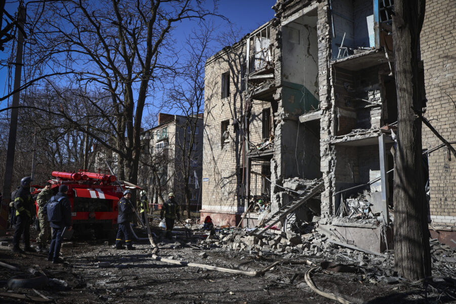 Ukrainian Emergency Service rescuers work on a building damaged by shelling in Kramatorsk, Donetsk ...
