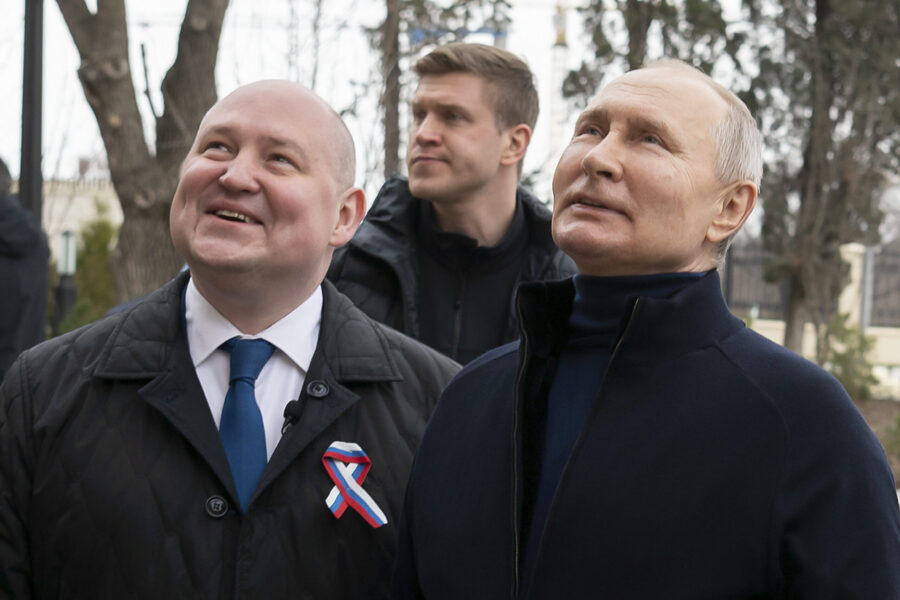 Russian President Vladimir Putin, right, and Governor of Sevastopol Mikhail Razvozhayev visit the C...