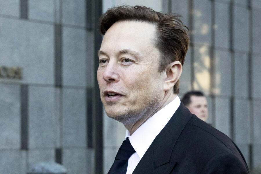 FILE - Elon Musk departs the Phillip Burton Federal Building and United States Court House in San F...