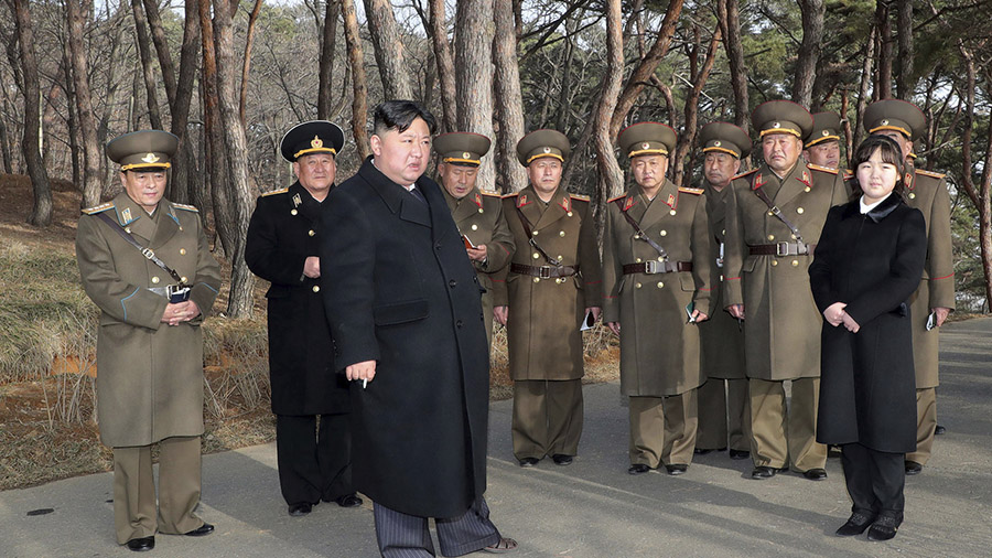 In this photo provided by the North Korean government, North Korean leader Kim Jong Un, with his da...