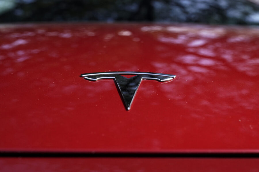 FILE - A Tesla logo is seen on a vehicle on display in Austin, Texas, Wednesday, Feb. 22, 2023. On ...