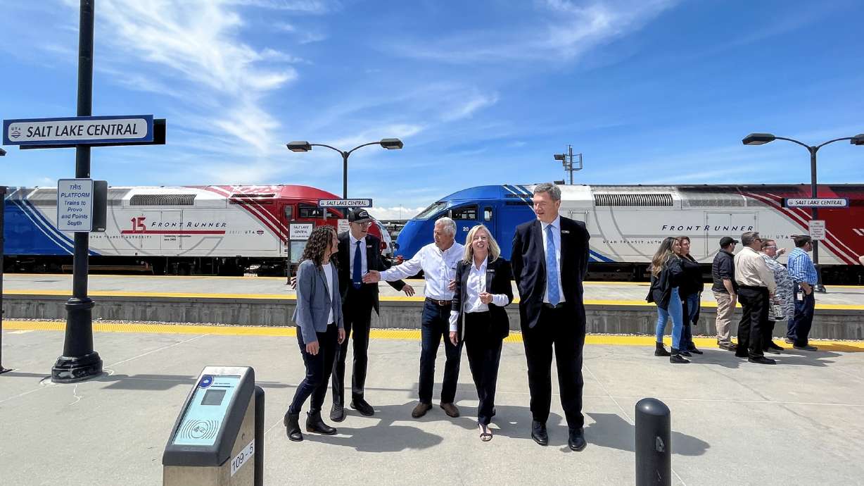 Utah Transit Authority Executive Director Jay Fox, second from left, and other UTA and UDOT officia...