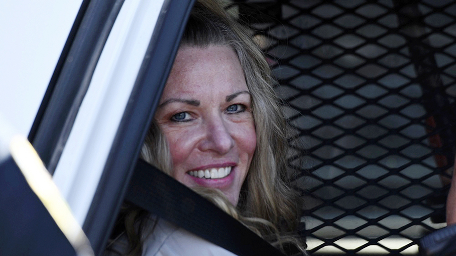 FILE - Lori Vallow Daybell sits in a police car after a hearing at the Fremont County Courthouse in...