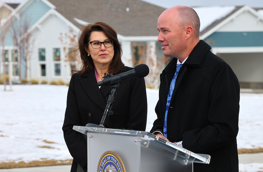Lt. Gov. Deidre Henderson listens to Gov. Spencer Cox as they release their proposed FY24 budget at...