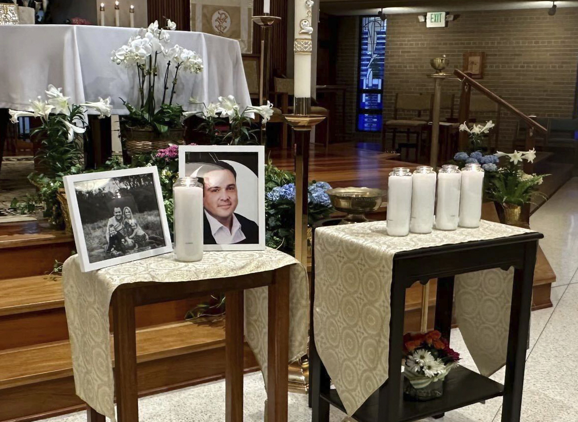 A memorial for Joshua Barrick is on display, late Monday, April 10, 2023, at Holy Trinity Catholic ...
